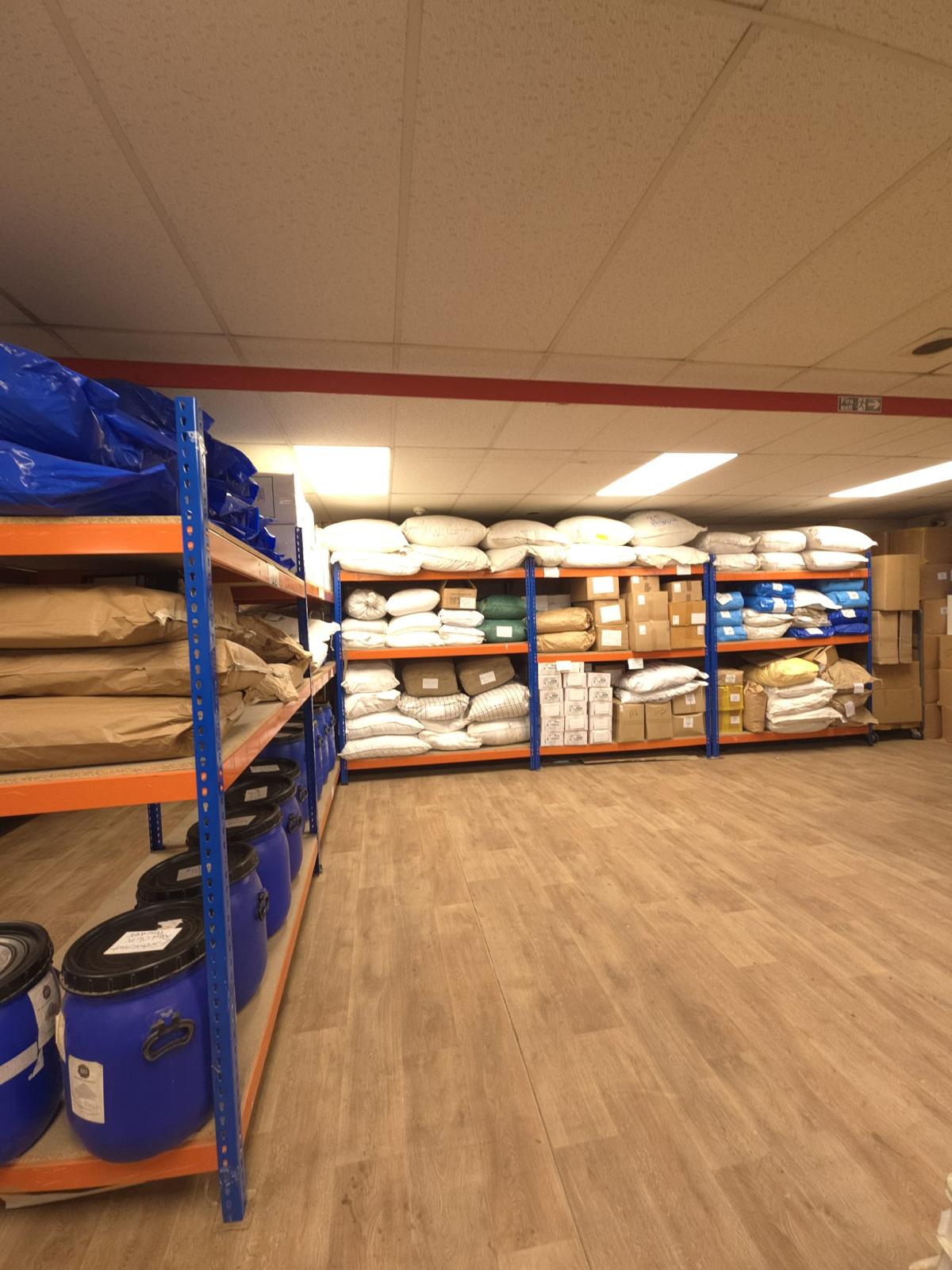 Spice Mart&rsquo;s Leicester warehouse, shelves stocked with bulk herbs, spices and packaging